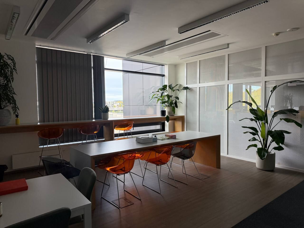 Long table with bar stools by the window
